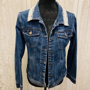 Denim Jean Jacket, embellished with white Lace collar and button bouquet on back.  Boho Upcycled Jean Jacket. Size 14-16
