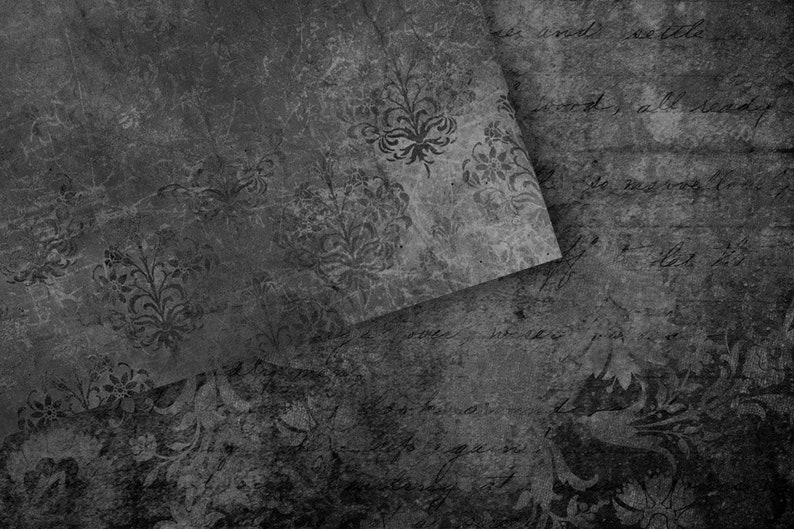 May include: A black and white textured background with a faded floral pattern. The background is made of paper and has a distressed look.
