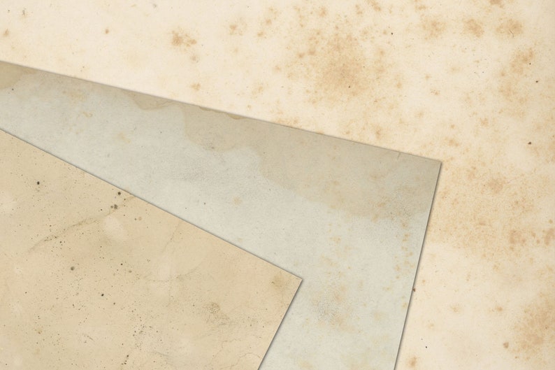 May include: Three pieces of textured, off-white paper with brown spots and stains. The paper is layered on top of each other, creating a triangular shape.