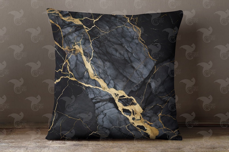 May include: Black and gold marble patterned throw pillow. The pillow has a dark gray background with gold veins running through it.