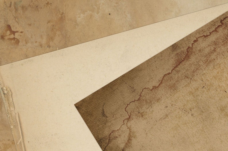 May include: A close-up of three pieces of textured paper, with a light brown, a medium brown, and a dark brown colour. The paper is layered on top of each other, creating a geometric pattern.