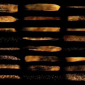 May include: A set of 12 gold glitter and paint brushstrokes on a black background. The brushstrokes are in various sizes and shapes, and some have a glittery finish.