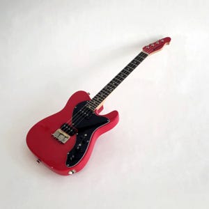 Ready to Ship! Slight handling damages, Pixelator- Baritone scale 19&quot; Electric Ukulele. Luthier set-up and ready to rock. Gig bag included.