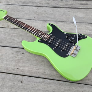 Custom Build Exosphere tenor solid body Electric Ukulele. Handmade in a choice of colors and finishes, triple pickups and working tremolo!