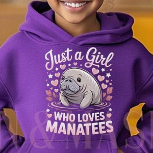 May include: A purple hoodie with the text "Just a Girl Who Loves Manatees" and a graphic of a manatee. The hoodie is worn by a young person with dark hair and blue jeans.