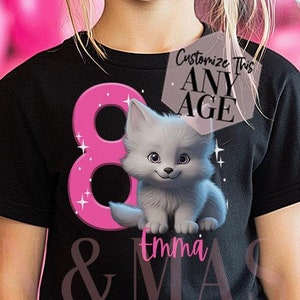 May include: Black t-shirt featuring a pink number 8 and a cartoon kitten. The shirt has the text "Emma" and "Customize This Any Age" printed on it. The background includes pink balloons and a smiling child.
