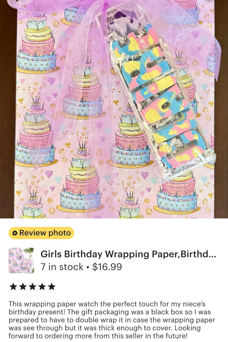 The image is a review photo of a girls birthday wrapping paper, Birthd.... 7 in stock priced at $16.99. The wrapping paper is described as a perfect touch for a birthday present, and the seller's note mentions that the gift packaging was a black box, which was prepared to have enough wrapping paper to cover the gift. The seller's rating of 5 stars indicates that the product is highly recommended.