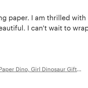 The image is a review of a pink dinosaur wrapping paper. The review expresses excitement about the purchase and mentions that the paper has a light gloss to it and the colors are beautiful. The review also mentions that the paper is being used to wrap a daughter's baby shower gifts, and the person is going to love it. The review is purchased item number: [0.00, 0.00, 0.99, 0.99]