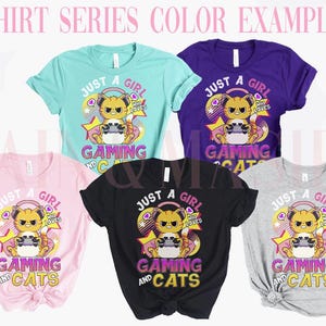 May include: A selection of t-shirts in colours such as teal, purple, pink, black, and grey. Each shirt displays a graphic of a cat wearing headphones and holding a game controller, with the text "Just a Girl Who Loves Gaming and Cats."