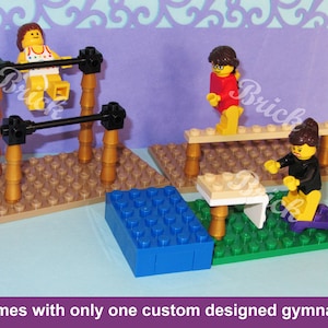 May include: A Lego gymnastics set featuring miniature figures on balance beams, uneven bars, and a vaulting table. The set includes a blue block and is set on a green and tan base. The text at the bottom says "Set comes with only one custom designed gymnast."