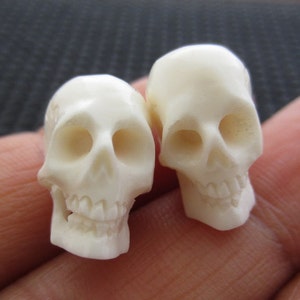 3 pieces of hand carved buffalo bone skull beads , drill top to bottom G148