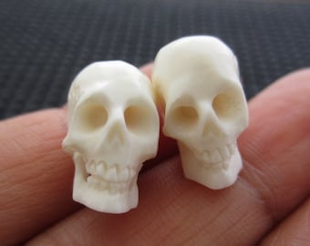 3 pieces of hand carved buffalo bone skull beads , drill top to bottom G148