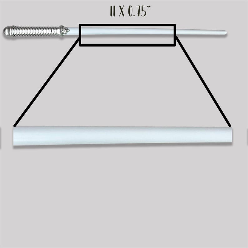 May include: A white wand with a silver-toned metallic handle featuring a ribbed texture and a star-shaped detail. The wand is displayed with a magnified view of its shaft, and the text 11 x 0.75" is printed above, indicating its dimensions.