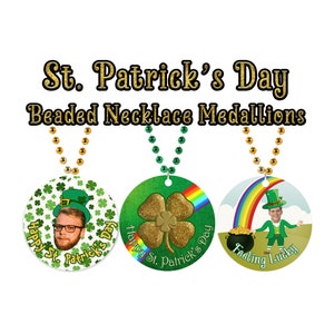 May include: St. Patrick's Day beaded necklace medallions. Three round medallions with images and text. One features a person wearing a green hat, another a gold glitter shamrock, and the last a leprechaun with a pot of gold. Each medallion is attached to a beaded necklace.