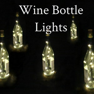Pack of 5 Wine Bottle Light Strands with 10 LEDs per strand.  Battery powered, on/off switch, batteries can be replaced. Warm White LEDs.