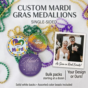 May include: Three round custom Mardi Gras medallions with colorful designs, including text like Let's Mardi 2026, Krewe of Froussard, and Maid Erica Ladner 2026. The medallions are surrounded by green, gold, and purple plastic bead necklaces.