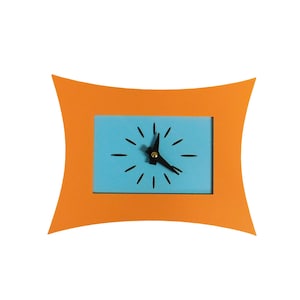 May include: A modern orange clock with a rectangular blue face. The clock hands are black, and the frame has a unique, curved design. The clock's face features black dashes marking the hours. This decorative clock is a stylish home decor item.