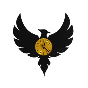 May include: A black wall clock in the shape of a phoenix with outstretched wings. The clock face is yellow with black hands and hour markers. The clock is a decorative item.