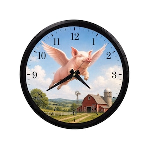 May include: A round wall clock with a black frame and a white face featuring black Arabic numerals. The center image depicts a pink pig with feathered wings flying over a rural landscape with a red barn, a silo, and a windmill under a blue sky.