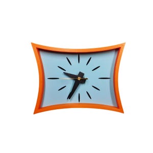 May include: A retro-style wall clock with an orange frame and a light blue face. The clock features black hands and hour markers. The clock's frame has a unique, curved shape, adding a mid-century modern aesthetic.