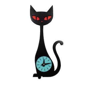 May include: A black cat-shaped wall clock with red eyes and a turquoise clock face. The clock has a long, slender body and a curved tail. The clock hands are black.