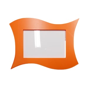 May include: An orange picture frame with a wavy, decorative design. The frame has a rectangular opening for a photo and is made of a solid, opaque material. The frame is a bright, vibrant orange color.