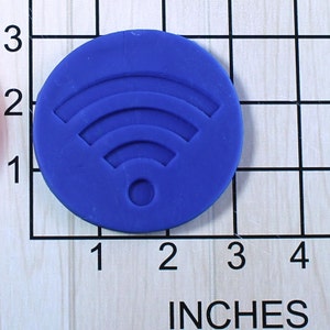 May include: A blue silicone mold shaped like a wifi symbol, measuring approximately 2 inches in diameter.