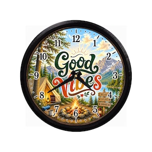 May include: A round wall clock with a black frame featuring a camping scene with a tent, campfire, and mountains. The text Good Vibes is printed in the center. A wooden signpost displays the words Relax, Explore, and Unwind near a lake.