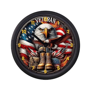 May include: Black round wall clock with a patriotic design. The clock face features an American flag, an eagle, and the word "VETERAN". Military boots and gear are also depicted. The clock hands are black, and the numbers are gold.