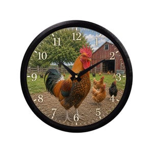 May include: A round wall clock with a black frame featuring a farm scene. A rooster stands in front of a barn with chickens. The clock face has black hands and traditional numerals.