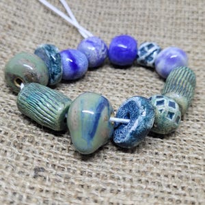 Set of 12 Handmade Colorful Ceramic Beads – Glazed, Unique, and Artisan-Crafted