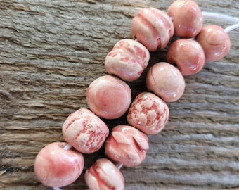 Handmade Pink Ceramic Beads – Glazed, Unique, and Artisan-Crafted Set of 12