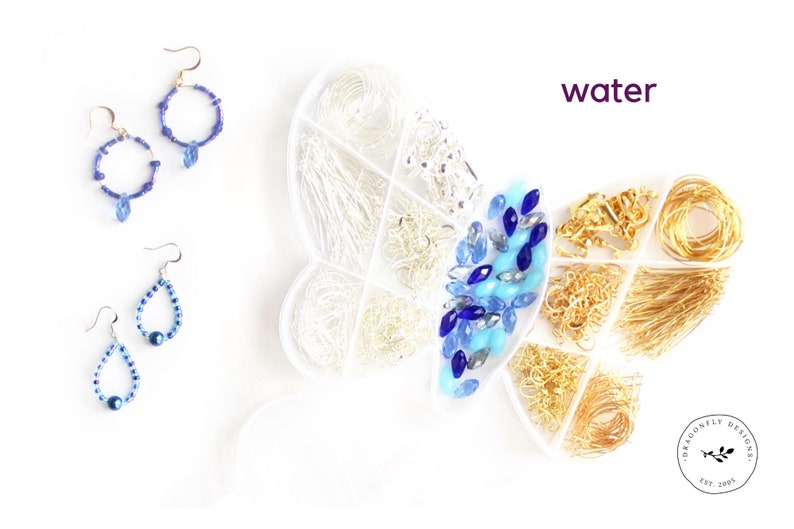 May include: An overhead shot displays jewelry-making supplies and finished earrings. A butterfly-shaped container holds silver and gold findings, blue and clear beads. Two pairs of blue beaded earrings are also shown. The word "water" is written in purple.