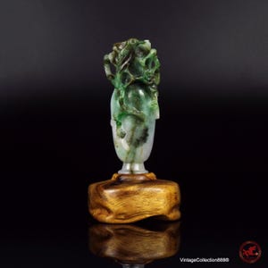 Antique 19th Century Chinese Jade Vase or Snuff Bottle, Qing Dynasty, carved with a bird, tree, flowers and elephant-headed handle