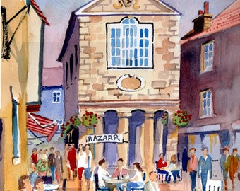 Shambles Market, Whitby. A busy street scene with cafes and people.