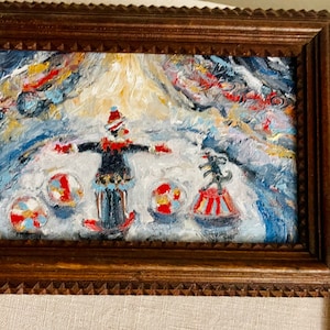 The Circus Ring oil painting in a tramp art antique frame.