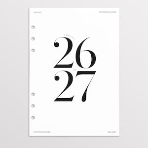 May include: A white monthly planner page with the years "2026-2027" printed at the top and bottom. The text "TWENTY 26 to 27" is in large, bold, black font. The bottom of the page has the text "MONTH ON TWO PAGES 2026-27 Edition".