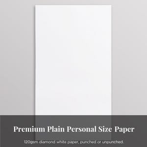 Könnte beinhalten: Ein vertikales Blatt weißes Papier vor grauem Hintergrund. Der Text unten lautet "Premium Plain Personal Size Paper" und "120gsm diamond white paper, punched or unpunched."
