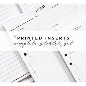 May include: A close-up of a set of printable planner inserts. The inserts are white with black text and include sections for "Top Three", "To Dos", "Today", and "Schedule". The text "PRINTED INSERTS complete starter set" is visible in the centre of the image.
