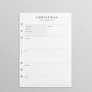 Op de afbeelding: Een wit papieren kerstmenu-plannerblad met zes ringbandgaten aan de linkerkant. De koptekst luidt Christmas menu planner. Secties bevatten Occasion, Date & time, People attending, Drinks, Starters, Mains, Desserts en Notes met lijnen.