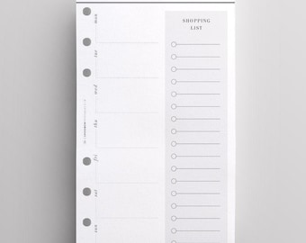 May include: A white paper meal planner insert with six binder holes on the left side. The header reads MEAL PLANNER. The layout includes a weekly schedule from Monday to Sunday and a vertical shopping list section with twelve circular checkboxes.