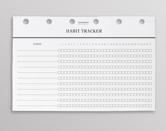 May include: A white paper habit tracker insert with six binder holes at the top. The header reads "CROSSBOW PRINTABLES" and "HABIT TRACKER". It features ten rows with a "HABIT" label, dotted lines for writing, and thirty-one small square checkboxes.