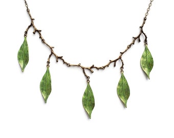 May include: A delicate necklace with a twig design and five green leaves hanging from it.
