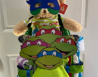 Pastel de pañales con triciclo y temática de las Tortugas Ninja / Pastel de pañales / Pastel de pañales para bebé / Oso de peluche / Oso de peluche para niño / Hacer un pastel de pañales /