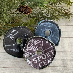 May include: Three round fabric patches with different designs. The first patch has a black and white design of a golf club and the text "Golf Club". The second patch has a black and white design of a chess piece and the text "Sport Center". The third patch has a blue and white design of fish.