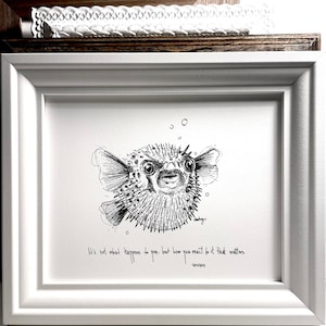 May include: Black and white illustration of a pufferfish with the quote "It's not what happens to you, but how you react to it that matters - Epictetus" printed below.