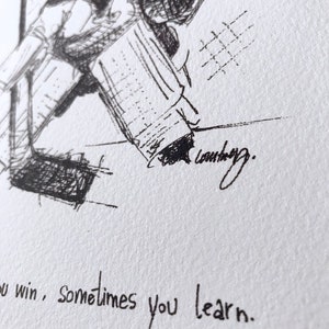 May include: Black and white ink drawing of a hockey player in action, with the text "You win, sometimes you learn." below the image.