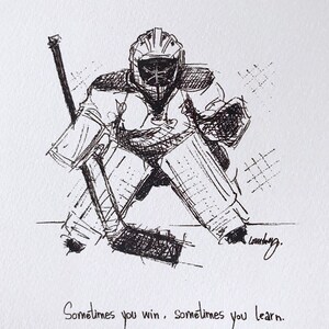 May include: Black and white ink drawing of a hockey goalie in a crouched position, with a stick in front of them. The drawing is signed "Launberg" and includes the text "Sometimes you win, sometimes you learn."