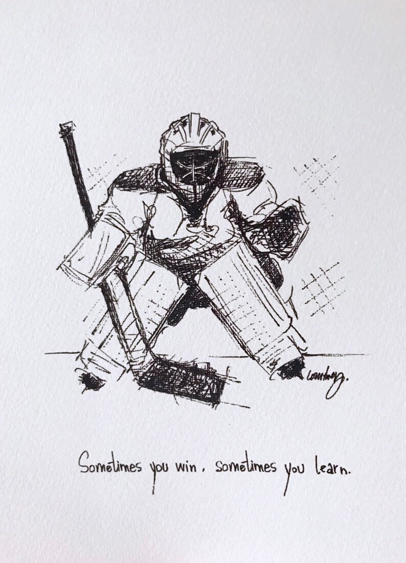 May include: Black and white ink drawing of a hockey goalie in a crouched position, with a stick in front of them. The drawing is signed "Launberg" and includes the text "Sometimes you win, sometimes you learn."