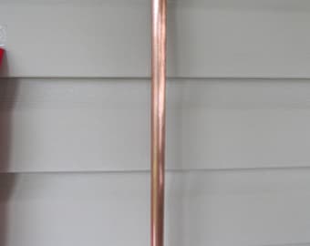 copper stake for Adele's flowers, 1/2 inch diameter, approximately 31 inches in length